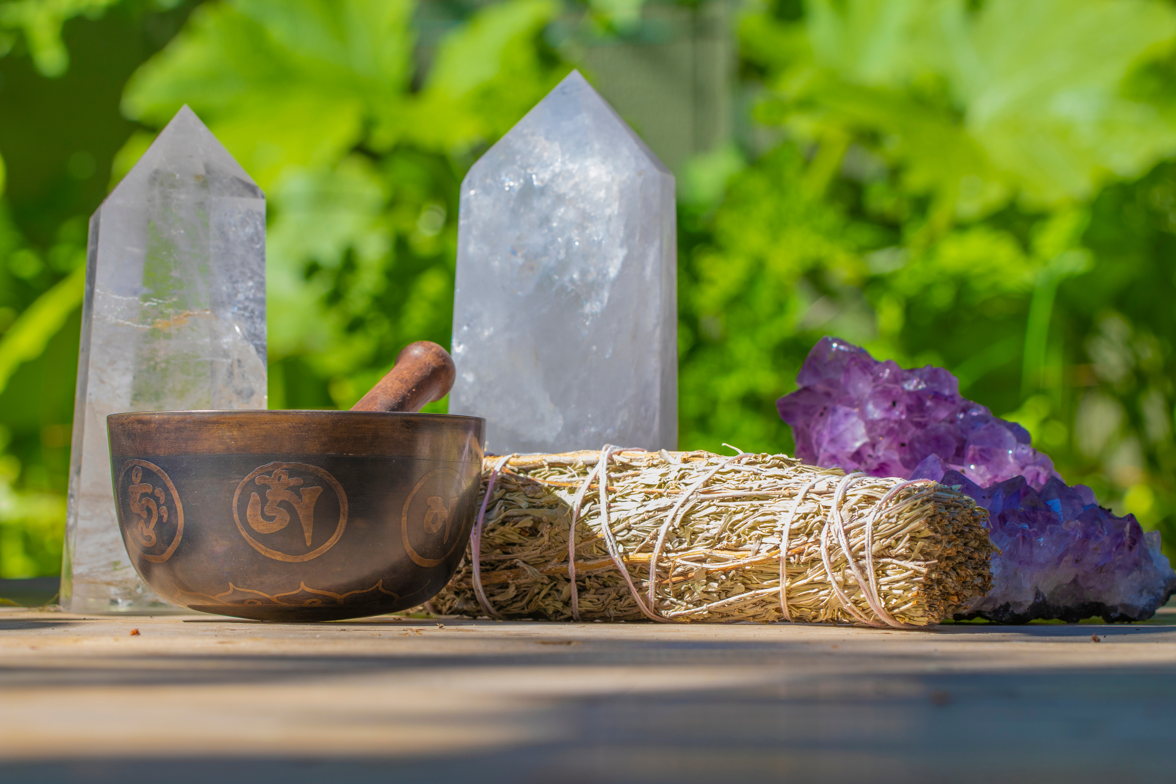 A Beautiful Tibetan Singing Bowl with Sage and several Crystals